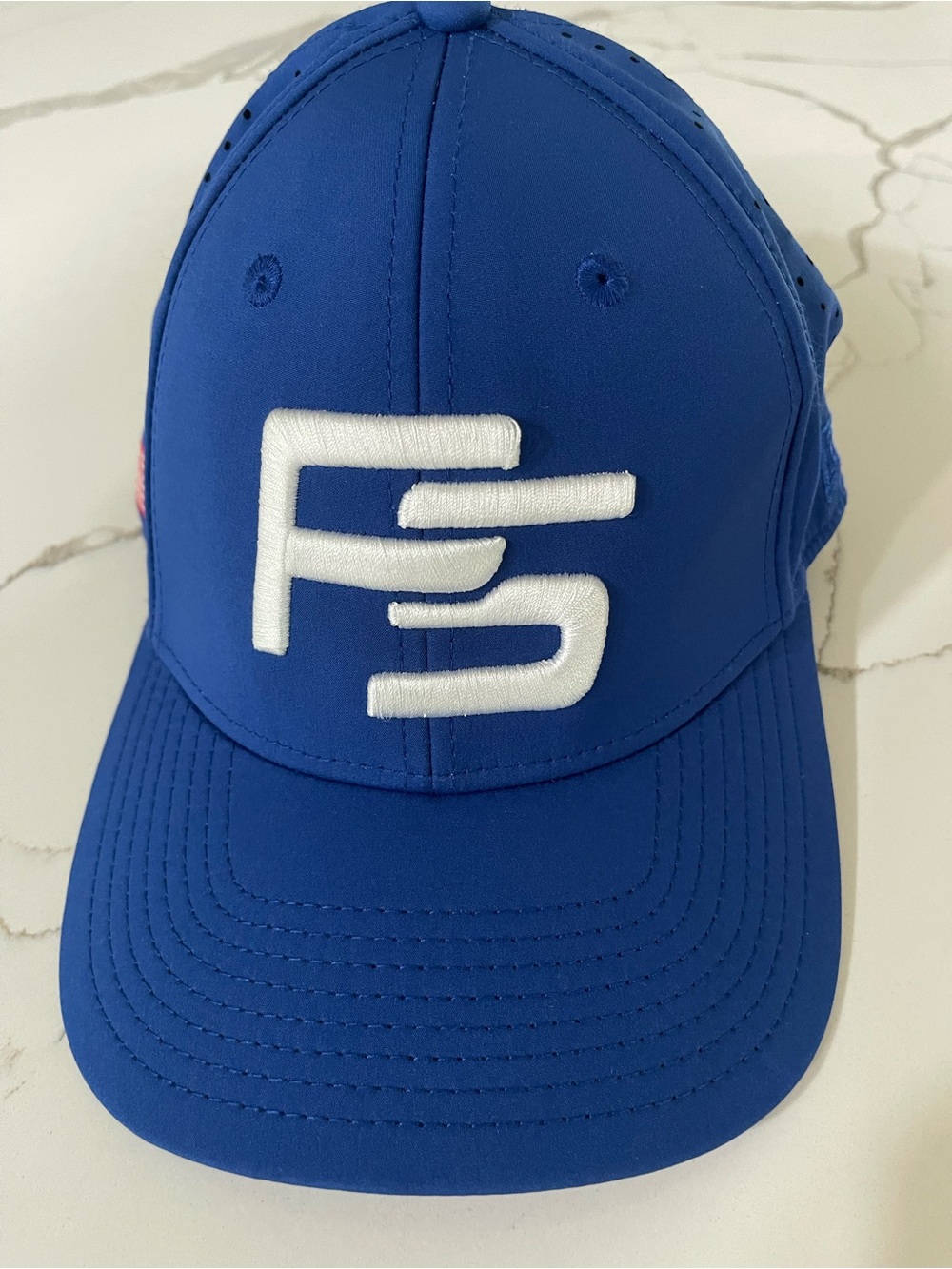 Blue Baseball Cap with White Embroidered Logo